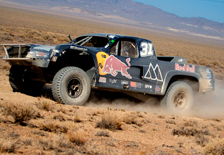 Monster Energy Trophy Truck kicking up dirt in the Baja 1000
