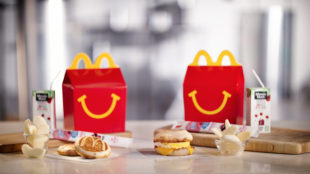 This photo provided by McDonald's shows a breakfast Happy Meal. McDonald's is considering another addition to its all-day breakfast menu: Happy Meals. The fast-food chain says it will begin testing breakfast Happy Meals in Tulsa, Oklahoma on Sept. 26. The Happy Meals come with either two McGriddles cakes or an egg and cheese McMuffin.(McDonalds via AP)