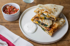 This August 2016 photo shows spinach, mushroom, and chicken quesadillas in New York. This dish is from a recipe by Katie Workman. (Sarah Crowder via AP)