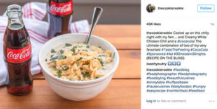 This image provided by Vox Media shows a social media post featuring a bottle of Coca-Cola next to a bowl of chicken chili. Coca-Cola is trying to sell more of its flagship beverage by suggesting the cola can accompany a wide range of meals, rather than just the fast food and pizza with which it’s a mainstay. (Becky Hardin @thecookierookie/Vox Media/Vox Creative via AP)