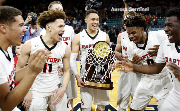 Eaglecrest team members jubilantly react to winning the 5A State Championship game against George Washington March 11 at the Denver Coliseum. Eaglecrest overcame a six-point deficit at the end of the first half defeating George Washington 53-47. (Photo by Philip B. Poston/Aurora Sentinel)
