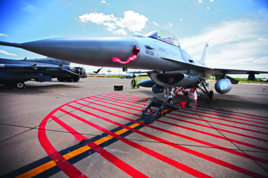 Master Sgt. Ricky Kissell, a crew chief for the 140th Wing of the Colorado Air National Gaurd, gives his F-16 a bath at Buckley Air Force Base. The Air Force's F-16s are soon to be replaced by the new F-35 fighter jet. (Marla R. Keown/Aurora Sentinel)
