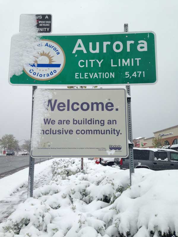 A sign near Aurora's western city limit on East Iliff Avenue is seen May 12. Snow snarled traffic Monday for commuters driving into the city. (Marla Keown/Aurora Sentinel)