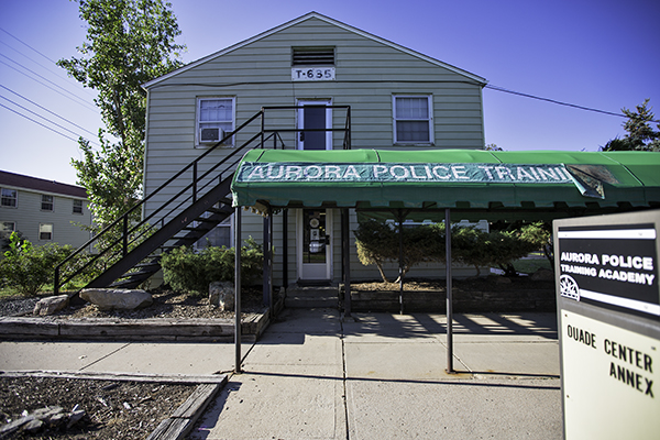 A tattered awning shades an entrance to the Aurora Police Training Academy, Aug. 27 at Fitzsimons. The city's police and fire staff have been lobbying for a new training center for years, saying their current facilities are rundown and unsafe. (Marla R. Keown/Aurora Sentinel)