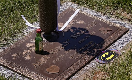 The marker of the grave site of Alex Sullivan is pictured at a cemetery on Thursday, July 18, 2013, in Wheat Ridge, Colo. Alex was killed along with 11 others in the Aurora theater shooting last July on his 27th birthday. Saturday July 20 is the anniversary of the shooting. (AP Photo/Ed Andrieski)
