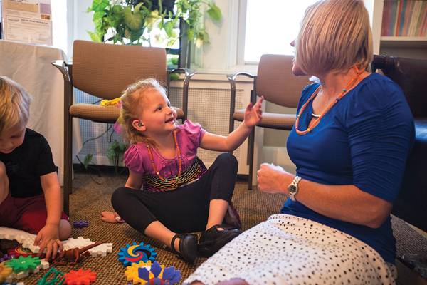 Nyla Morisset, 5, talks with her audiologist doctor Stacy Claycomb at the Marion Downs Hearing Center. (Marla R. Keown/Aurora Sentinel)