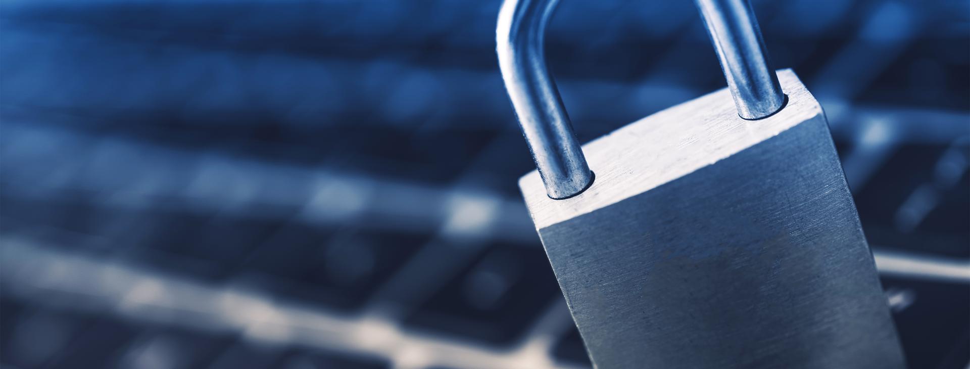 locked padlock on keyboard