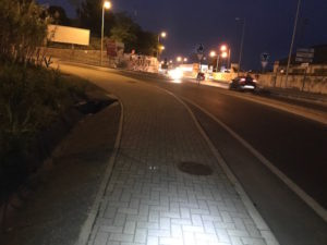 Walking along a busy highway at night during the Camino Portuguese.