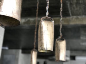 Cow bell lights at the receptionist desk at N1 Hostels.