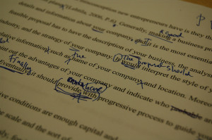 Typed essay with handwritten proofreading marks