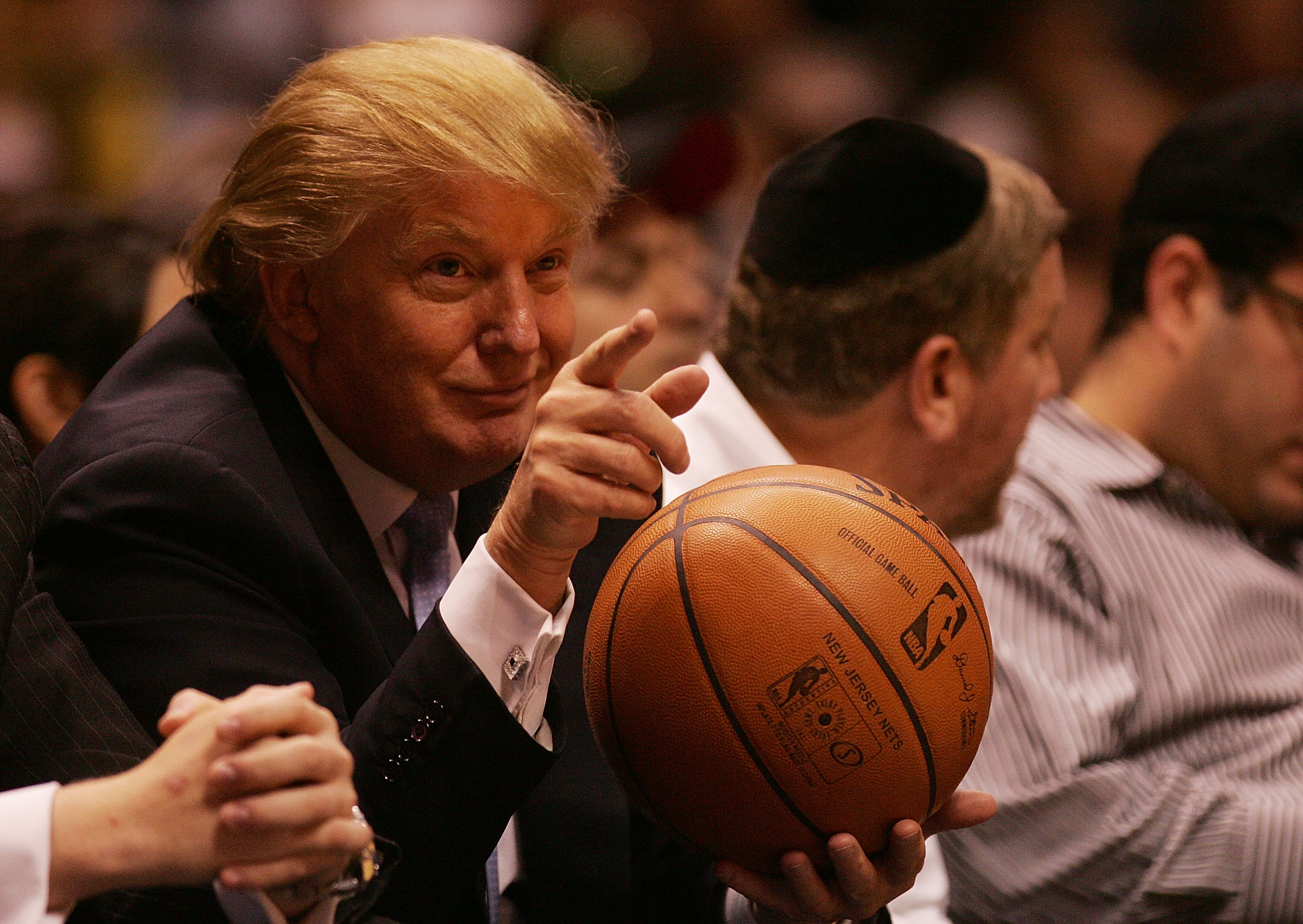 EAST RUTHERFORD, NJ - OCTOBER 31:  Donald Trump sits courtside at the New Jersey Nets and the Chicago Bulls game at the Izod Center on October 31, 2007 in East Rutherford, New Jersey. NOTE TO USER: User expressly acknowledges and agrees that, by downloading and or using this photograph, user is consenting to the term and conditions of the Getty Images License Agreement (Photo by Nick Laham/Getty Images)