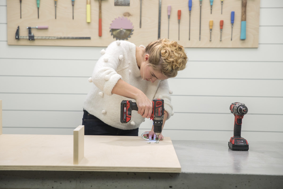 attaching hooks on storage pegboard