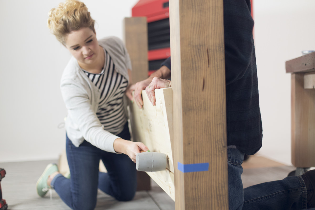 attaching bed frame with rubber mallet