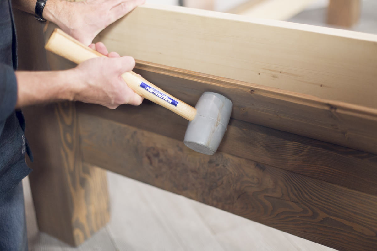 rubber mallet on bed frame headboard