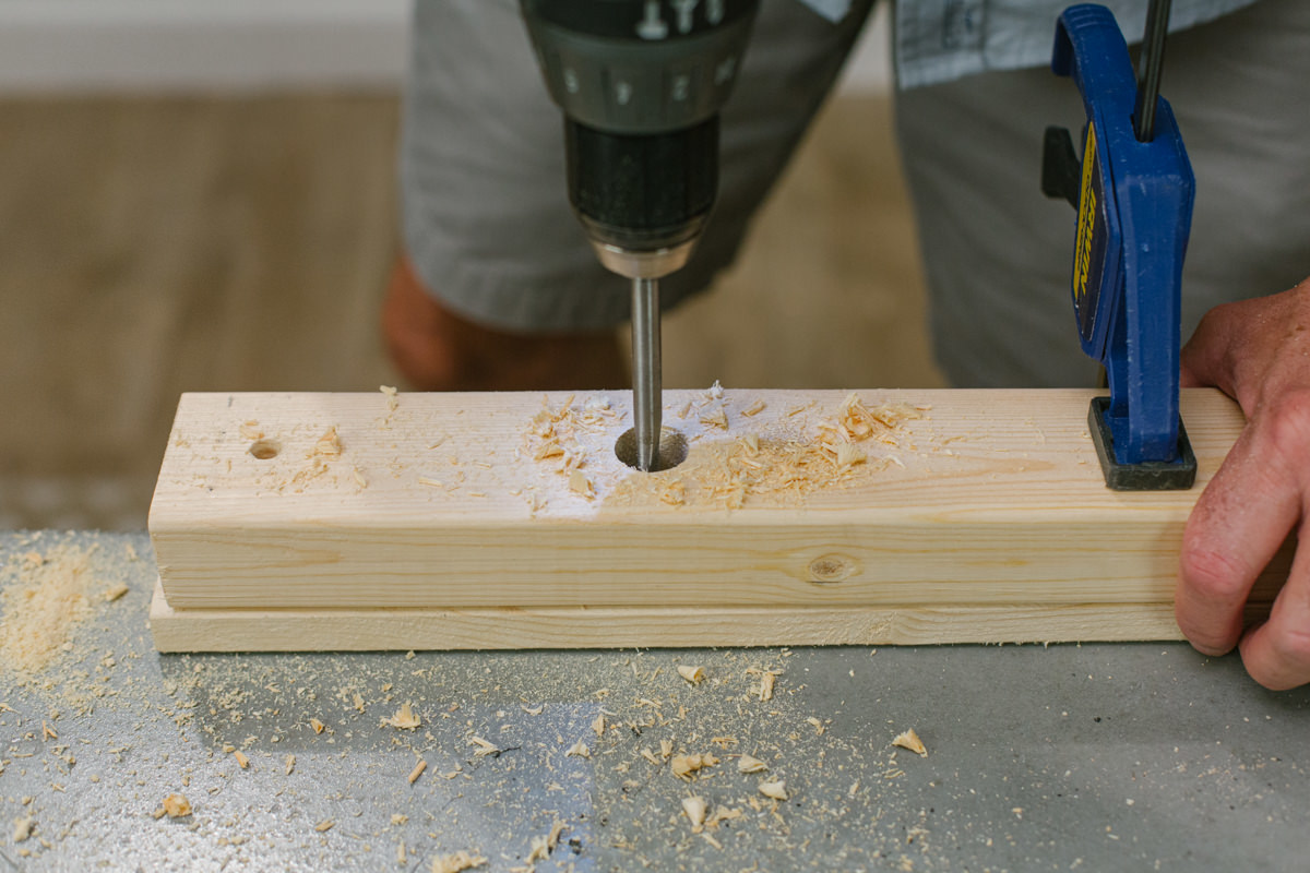 Drilling hole in clamped board.