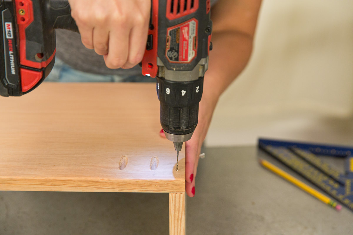 Pre-drilling hole in doug fir board.