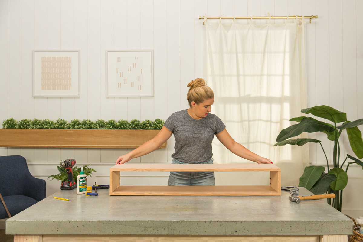 Long rectangle of doug fir creating wood DIY coffee table assembly.