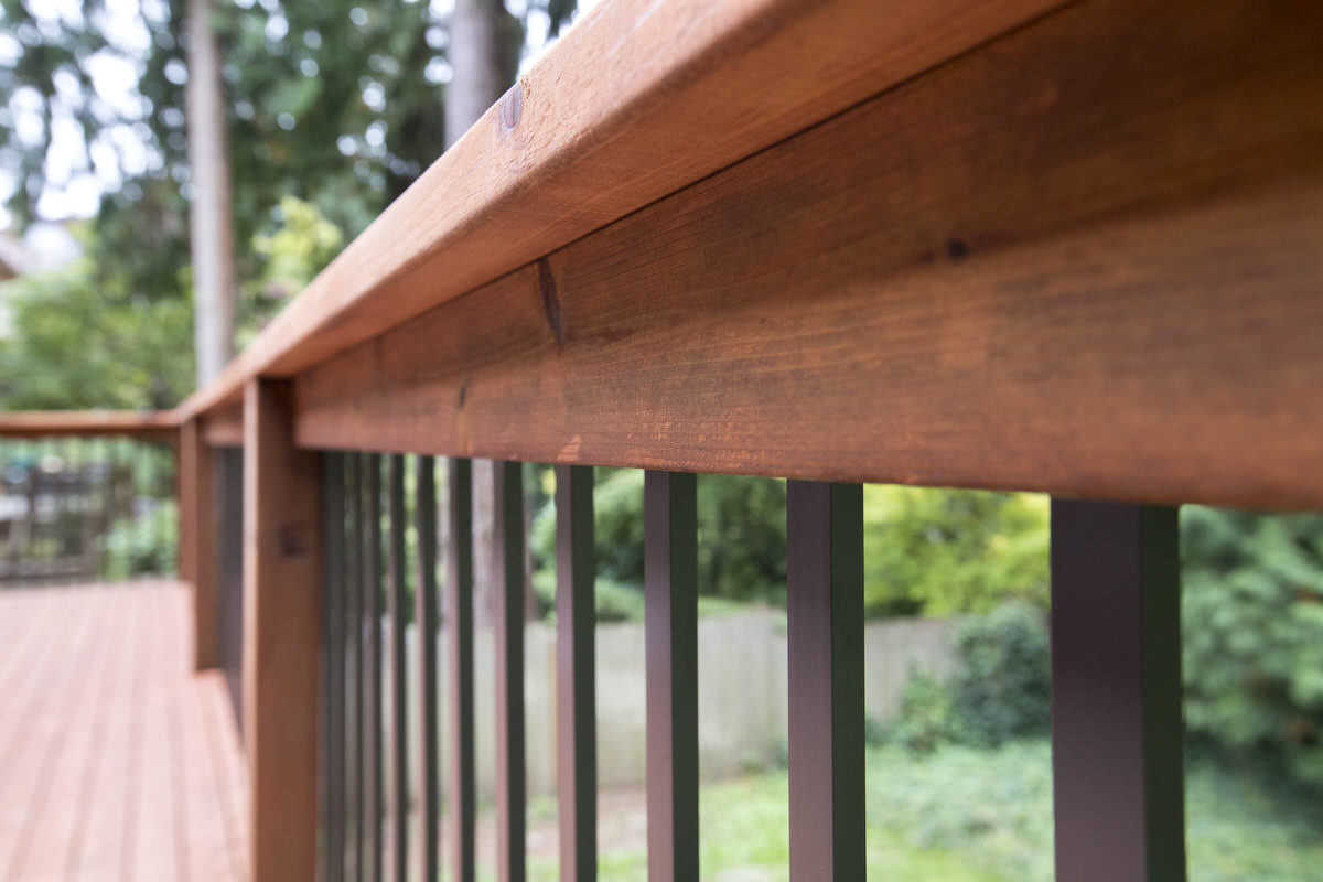 Cedar decking stained with TWP rustic. 