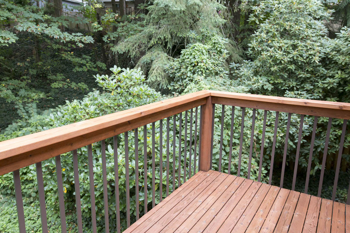 Cedar decking stained with TWP rustic. 