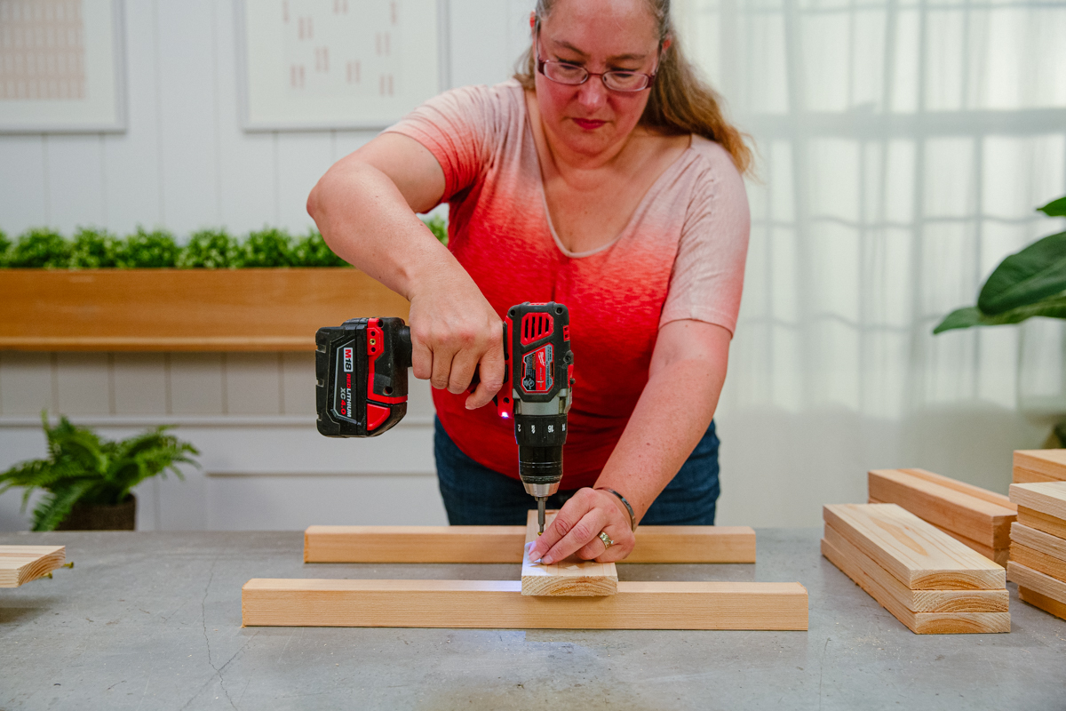 Driving screw to attach a side board to posts.