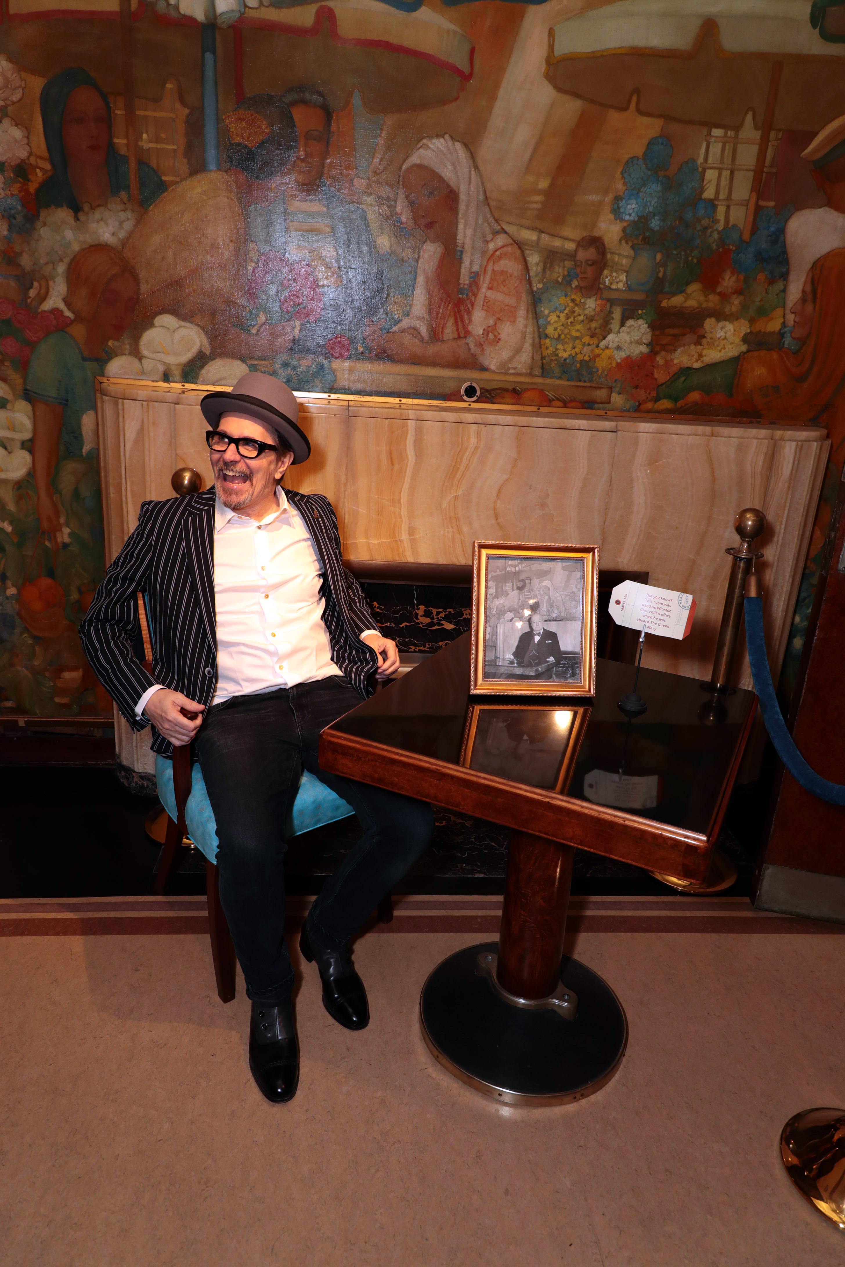 Gary Oldman having a great time at the Their Finest Hour exhibit in The Queen Mary