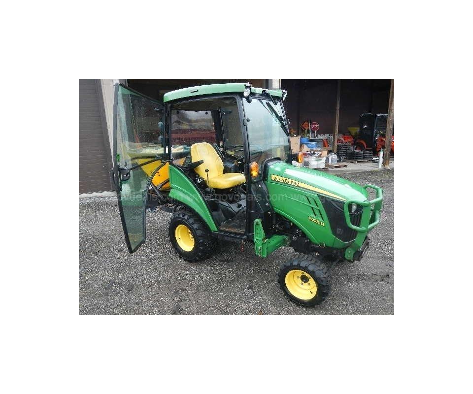 2017 John Deere 1025R Tractor with Mauser Cab & Several Implements