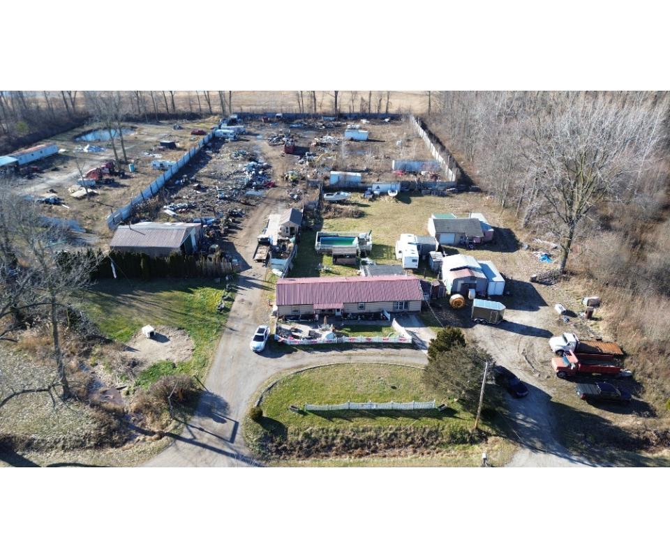 Salvage Yard on 4.78+/ Acres with Heated Office, House, Buildings