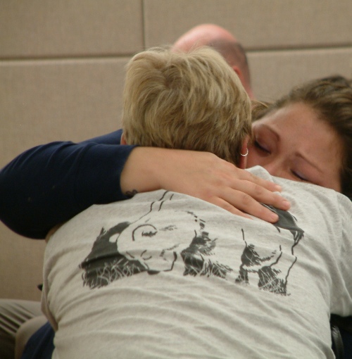 Haley Tokuoka and Debbie Greene embrace after a jury returns with a verdict convicting John N. Marvin Jr. of the murders of Matthew Tokuoka and Tony Wallace in November 2012. (Photo by Matt Miller/KTOO)