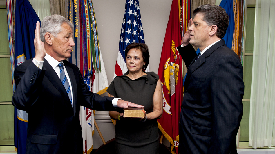 Image hagel272way_wide-537f4d4cf260d2775993065316c8ad980cc90fa2-s6.jpg New Defense Secretary Chuck Hagel, left, as he was sworn in Wednesday morning at the Pentagon. His wife, Lilibet, held the Bible. Michael L. Rhodes, the Pentagon's director of administration and management, administered the oath. MC1 Chad J. McNeeley/Office of the Secretary of Defense