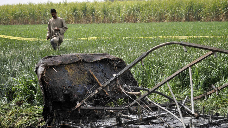 Image ballooncrash262way_wide-237c43c09d7023e4e2874dadf3c15a95164fbae5-s6.jpg The wreckage of a hot air balloon and its gondola lay in a field near Luxor, Egypt, on Tuesday. A fire and subsequent crash killed many of those who were aboard the tourist flight. Reuters /Landov