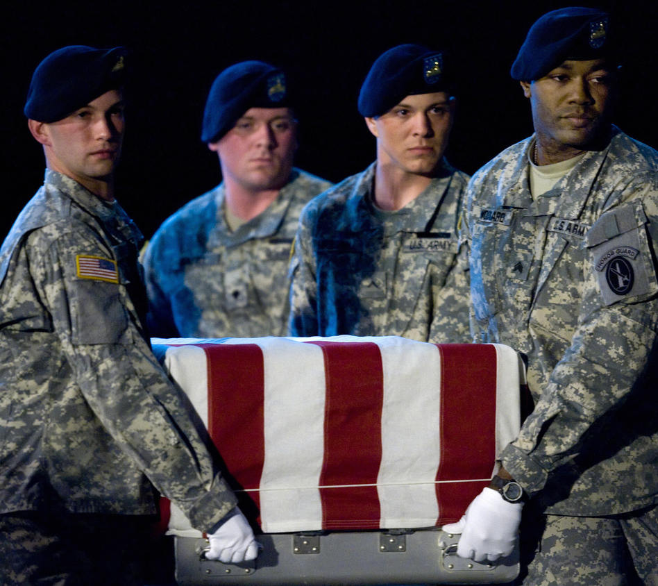 Members of the US Army's Old Guard carry team lift the remains of U.S. Army Specialist Israel Candelaria Mejias Members of the US Army's Old Guard carry team lift the remains of U.S. Army Specialist Israel Candelaria Mejias from San Lorenzo, Puerto Rico, as his body is returned on a C-17 to the U.S. from Iraq on April 7, 2009. Paul J. Richards /AFP/Getty Images
