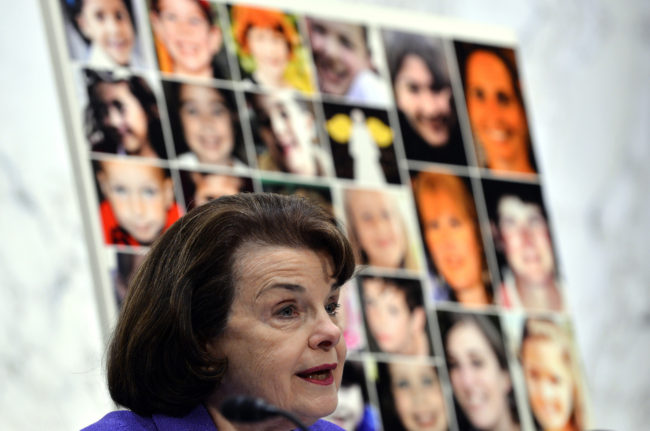 Dianne Feinstein Pictures of Newtown's Sandy Hook Elementary School shooting victims are displayed as Senate Judiciary Committee chairperson Dianne Feinstein speaks during a hearing on "The Assault Weapons Ban of 2013" at the Hart Senate Office Building in Washington, DC, on February 27, 2013. Jewel Samad /AFP/Getty Images