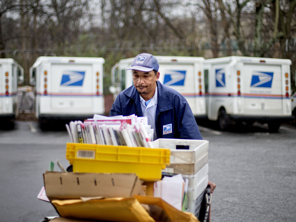 Image ap348131Veteran USPS letter carrier Michael McDonald gathers mail to load into his truck before making his delivery run in the East Atlanta neighborhood on Thursday, Feb. 7, 2013, in Atlanta. David Goldman/AP591501-9eb295d75f13ae7bbdde885754a5e925cc87c914-s6.jpg Veteran USPS letter carrier Michael McDonald gathers mail to load into his truck before making his delivery run in the East Atlanta neighborhood on Thursday, Feb. 7, 2013, in Atlanta. David Goldman/AP
