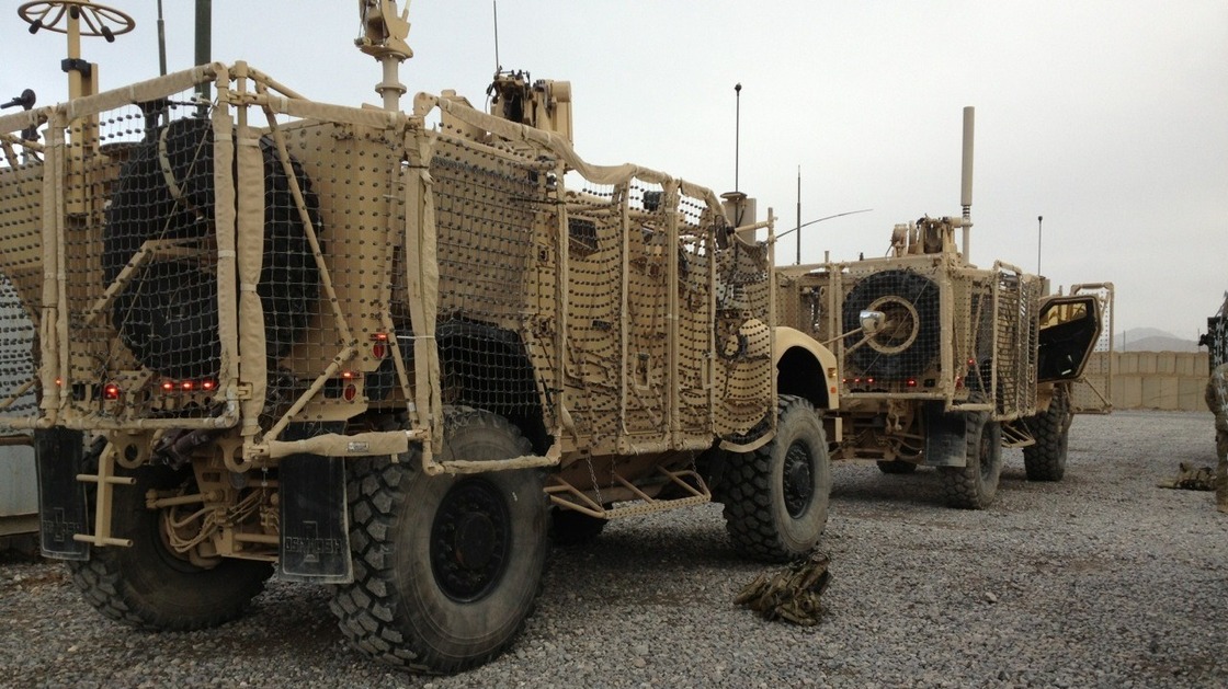 trucks A pair of mine-resistant, ambush-protected vehicles are lined up for a convoy to Kandahar Airfield. One of the trucks broke down before leaving Forward Operating Base Frontenac. The unit has to move out 50 vehicles from the compound. Sean Carberry/NPR
