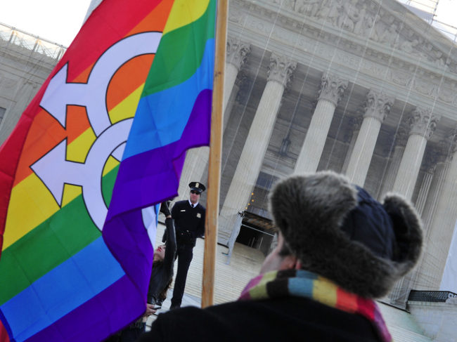 A pro-gay-marriage protester stands in front of the Supreme Court on Tuesday, the first of two days of oral arguments on challenges to laws that limit the definition of marriage to unions of a man and a woman. Karen Bleier/AFP/Getty Images A pro-gay-marriage protester stands in front of the Supreme Court on Tuesday, the first of two days of oral arguments on challenges to laws that limit the definition of marriage to unions of a man and a woman. Karen Bleier/AFP/Getty Images