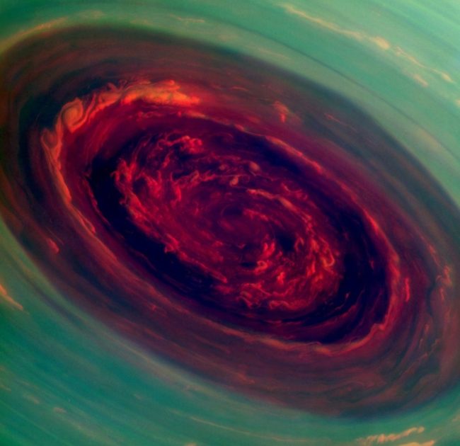 A mammoth spinning vortex is seen on Saturn, in this "false-color" photograph released by NASA Monday. The image was captured by the Cassini spacecraft. A related image, presenting what a human eye would see, is farther down this page. NASA A mammoth spinning vortex is seen on Saturn, in this "false-color" photograph released by NASA Monday. The image was captured by the Cassini spacecraft. A related image, presenting what a human eye would see, is farther down this page. NASA