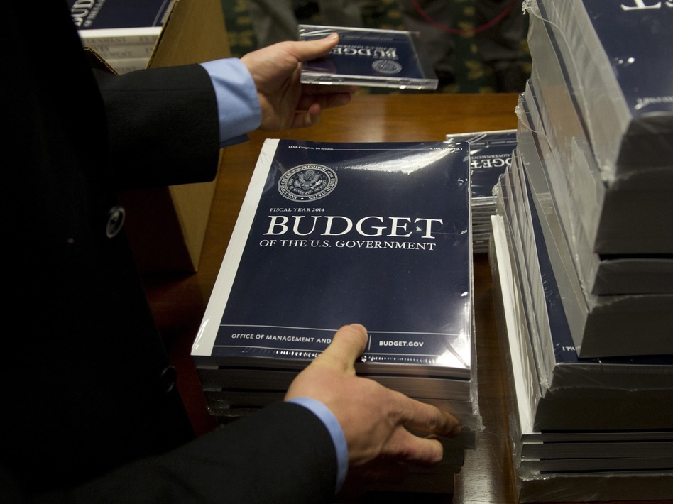 Senate budget committee staffers unpack boxes of President Obama's 2014 budget proposal on Wednesday. Saul Loeb/AFP/Getty Images Senate budget committee staffers unpack boxes of President Obama's 2014 budget proposal on Wednesday. Saul Loeb/AFP/Getty Images