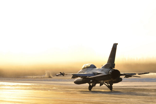 F-16 Fighting Falcon A U.S. Air Force F-16 Fighting Falcon taxis towards the flightline Oct. 27, 2011, Eielson Air Force Base, Alaska. The aircraft is assigned to the 18th Aggressor Squadron. (U.S. Air Force photo by Staff Sgt. Christopher Boitz/Released)