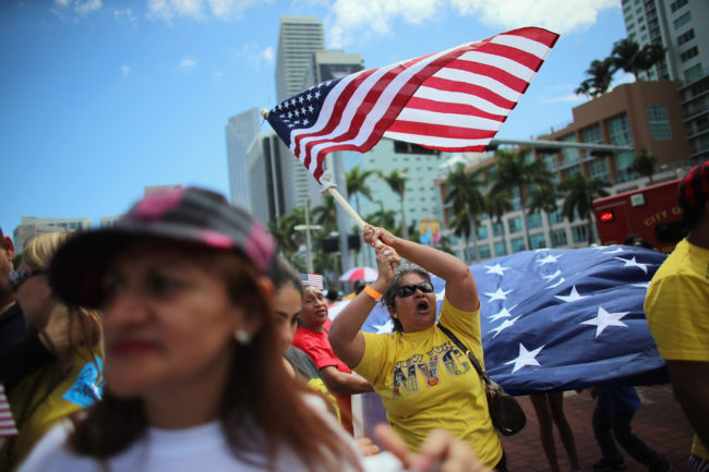 Maglena Gomez waves an American flag as she and others participate in a march that organizers said was an attempt to get the U.S. Congress to say yes to immigration reform on April 6, 2013 in Miami, Florida. Joe Raedle/Getty Images Maglena Gomez waves an American flag as she and others participate in a march that organizers said was an attempt to get the U.S. Congress to say yes to immigration reform on April 6, 2013 in Miami, Florida. Joe Raedle/Getty Images