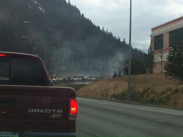 Smoke from the vehicle fire rises over the line of cars on Egan. Smoke from the vehicle fire rises over the line of cars on Egan.
