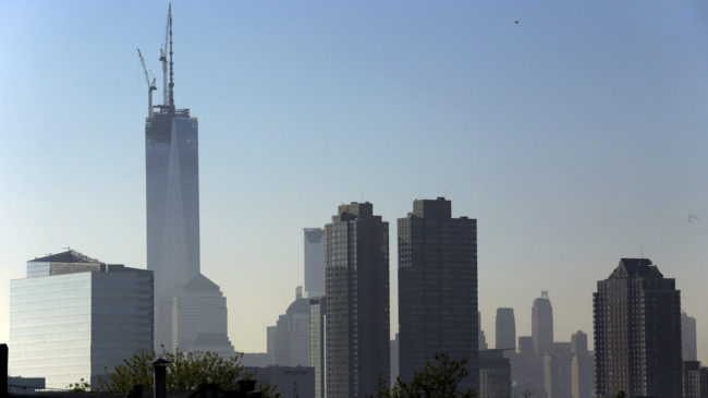 One World Trade Center stands at its full height of 1,776 feet Friday, after a crane lifted its spire into place. The New York City skyline is seen here from the Heights neighborhood of Jersey City, N.J. Julio Cortez/AP One World Trade Center stands at its full height of 1,776 feet Friday, after a crane lifted its spire into place. The New York City skyline is seen here from the Heights neighborhood of Jersey City, N.J. Julio Cortez/AP