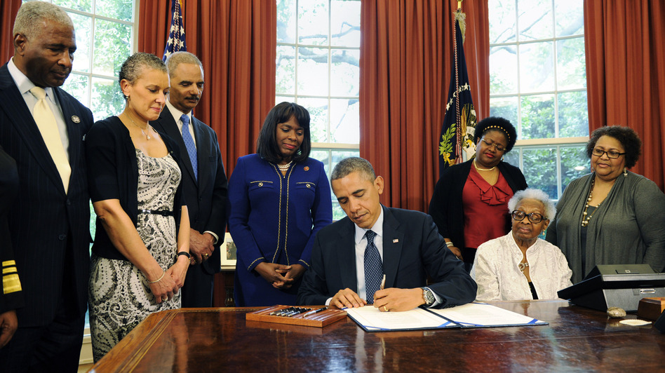 The Congressional Gold Medal has been posthumously awarded to four girls killed in the 1963 bombing of Birmingham's 16th Street Baptist Church. President Obama signed the legislation Friday, as (from left) Birmingham Mayor William Bell, Dr. Sharon Malone Holder, Attorney General Eric Holder, Rep. Terri Sewell, and relatives of Denise McNair and Carole Robertson look on. Pool/Getty Images The Congressional Gold Medal has been posthumously awarded to four girls killed in the 1963 bombing of Birmingham's 16th Street Baptist Church. President Obama signed the legislation Friday, as (from left) Birmingham Mayor William Bell, Dr. Sharon Malone Holder, Attorney General Eric Holder, Rep. Terri Sewell, and relatives of Denise McNair and Carole Robertson look on. Pool/Getty Images