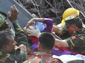 Rescuers carry a survivor who was buried for 17 days under the rubble of a building that collapsed in Saver, near Dhaka, Bangladesh. Parvez Ahmad Rony/AP Rescuers carry a survivor who was buried for 17 days under the rubble of a building that collapsed in Saver, near Dhaka, Bangladesh. Parvez Ahmad Rony/AP
