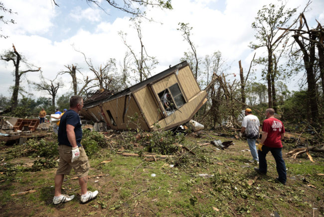 Volunteers help clean out Jean McAdams' mobile home after it was overturned by a tornado today near Shawnee, Oklahoma. Brett Deering/Getty Images Volunteers help clean out Jean McAdams' mobile home after it was overturned by a tornado today near Shawnee, Oklahoma. Brett Deering/Getty Images