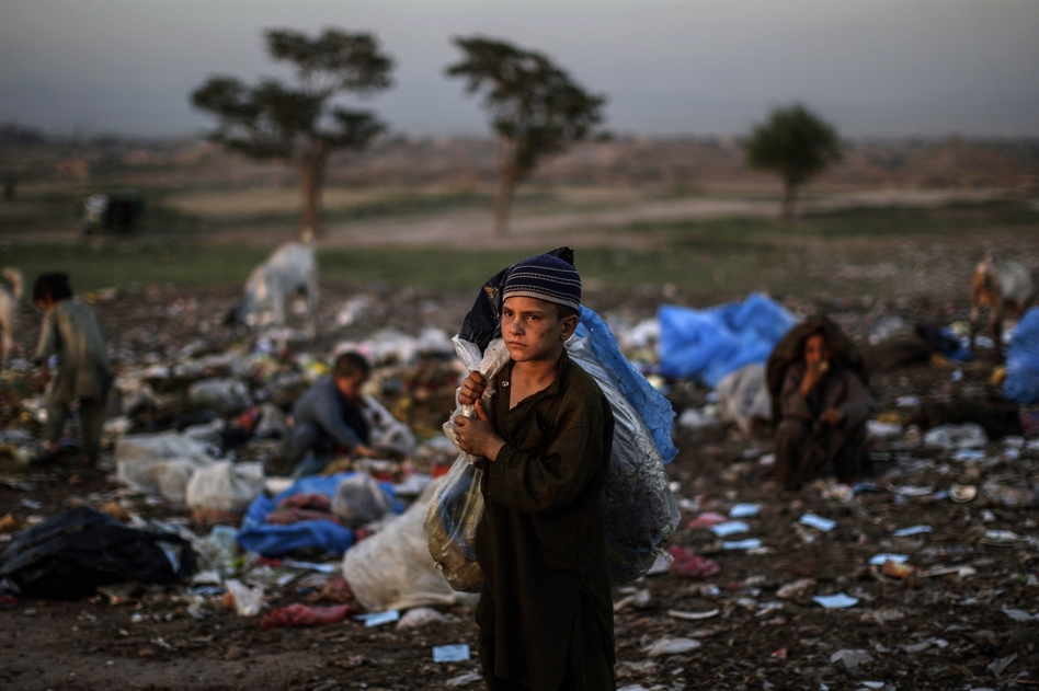 Afghan refugee children collect items of use from a pile of garbage on the outskirts of Islamabad, Pakistan. Muhammed Muheisen/AP Afghan refugee children collect items of use from a pile of garbage on the outskirts of Islamabad, Pakistan. Muhammed Muheisen/AP