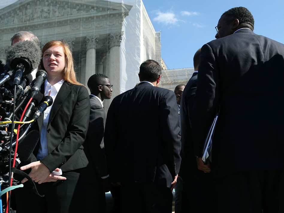 Abigail Noel Fisher, who challenged a racial component to University of Texas at Austin's admissions policy, speaks to the media outside the U.S. Supreme Court building during oral in the case in October. Mark Wilson/Getty Images Abigail Noel Fisher, who challenged a racial component to University of Texas at Austin's admissions policy, speaks to the media outside the U.S. Supreme Court building during oral in the case in October. Mark Wilson/Getty Images