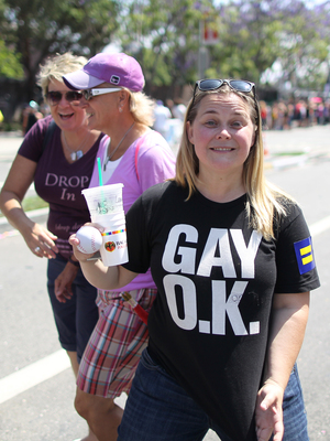 A new survey of more than 1,000 lesbian, gay, bisexual, and transgender adults finds that more than 90 percent feel more accepted in society than they did 10 years ago. Here, a woman displays her pro-gay T-shirt at the L.A. Pride Parade in West Hollywood last Sunday. David McNew/Getty Images A new survey of more than 1,000 lesbian, gay, bisexual, and transgender adults finds that more than 90 percent feel more accepted in society than they did 10 years ago. Here, a woman displays her pro-gay T-shirt at the L.A. Pride Parade in West Hollywood last Sunday. David McNew/Getty Images