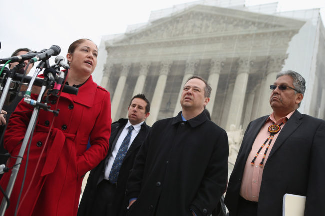 Mexican American Legal Defense and Education Fund Director of Litigation Nina Perales, left, MALDEF lawyer Luis Figaroa, Georgetown University law professor Jon Greenbaum and San Carlos Apache Tribal Chairman Terry Rambler talk with reporters outside the U.S. Supreme Court after attending oral arguements in Arizona v. Inter Tribal Council et al. on March 18 in Washington, D.C. Chip Somodevilla/Getty Images Mexican American Legal Defense and Education Fund Director of Litigation Nina Perales, left, MALDEF lawyer Luis Figaroa, Georgetown University law professor Jon Greenbaum and San Carlos Apache Tribal Chairman Terry Rambler talk with reporters outside the U.S. Supreme Court after attending oral arguements in Arizona v. Inter Tribal Council et al. on March 18 in Washington, D.C. Chip Somodevilla/Getty Images