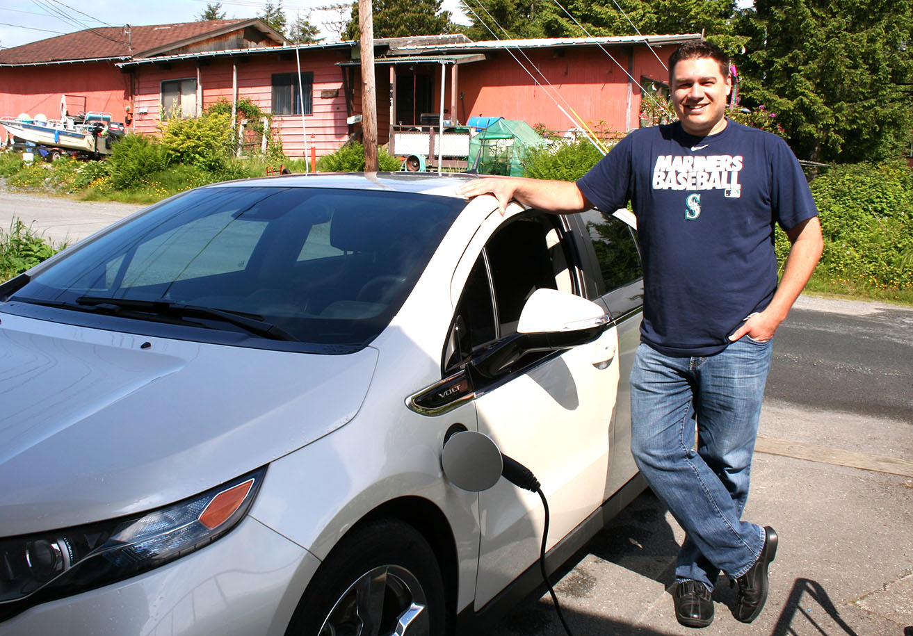 Sitka’s lone electric car owner, Michael Mahoney, standing next to his Chevy Volt. Sitka’s lone electric car owner, Michael Mahoney, standing next to his Chevy Volt.