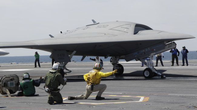 A Navy X-47B drone, seen here last month being launched off the aircraft carrier USS George H. W. Bush, successfully landed on the ship Wednesday, a first. Steve Helber/AP A Navy X-47B drone, seen here last month being launched off the aircraft carrier USS George H. W. Bush, successfully landed on the ship Wednesday, a first. Steve Helber/AP